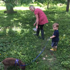 a young child holding a kite in a park