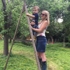 a person standing next to a tree