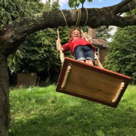 a person standing next to a tree