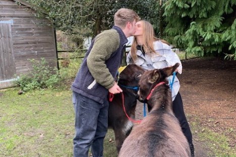 a man holding an animal