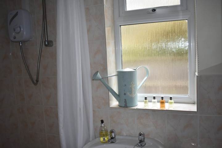 a room with a sink and a mirror