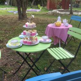 a couple of lawn chairs sitting on top of a picnic table