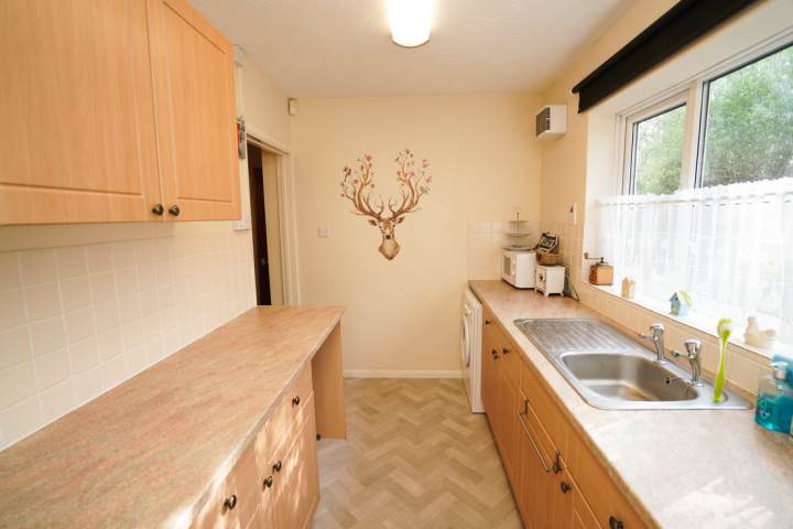 a kitchen with a sink and a window