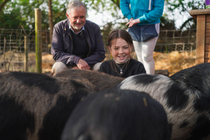 a man petting an animal
